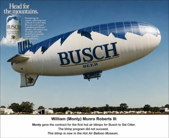 The Busch beer blimp flying over a field, with the Head for the Mountains advertisement inset