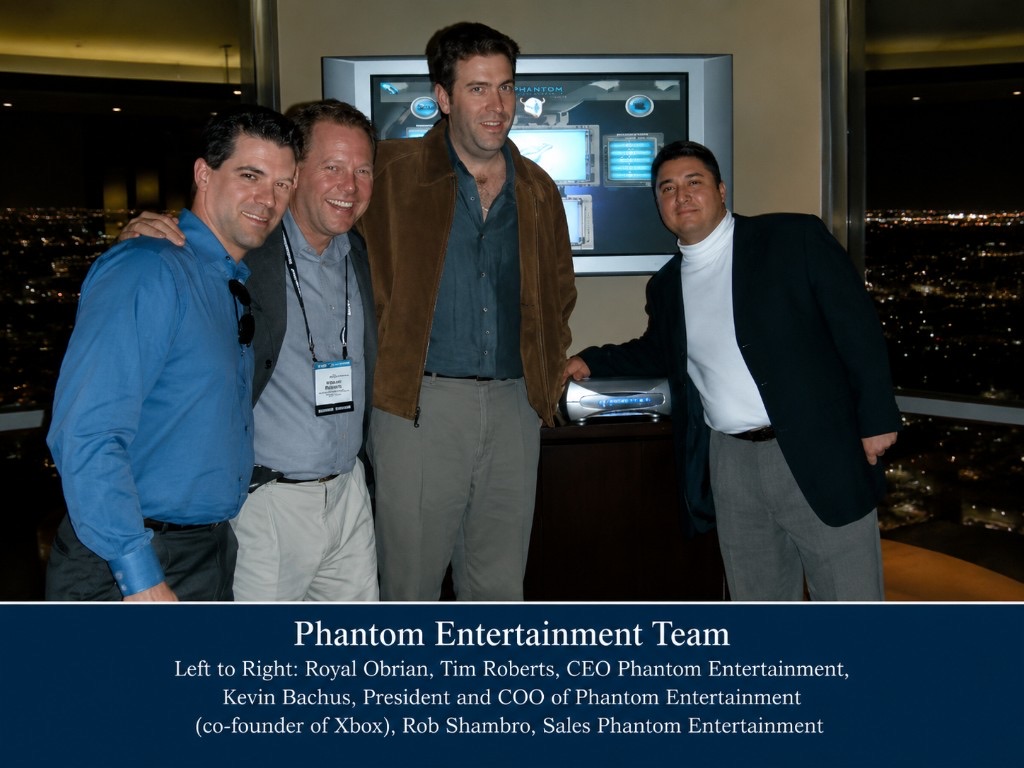 Phantom Entertainment leadership team beside the Phantom console prototype